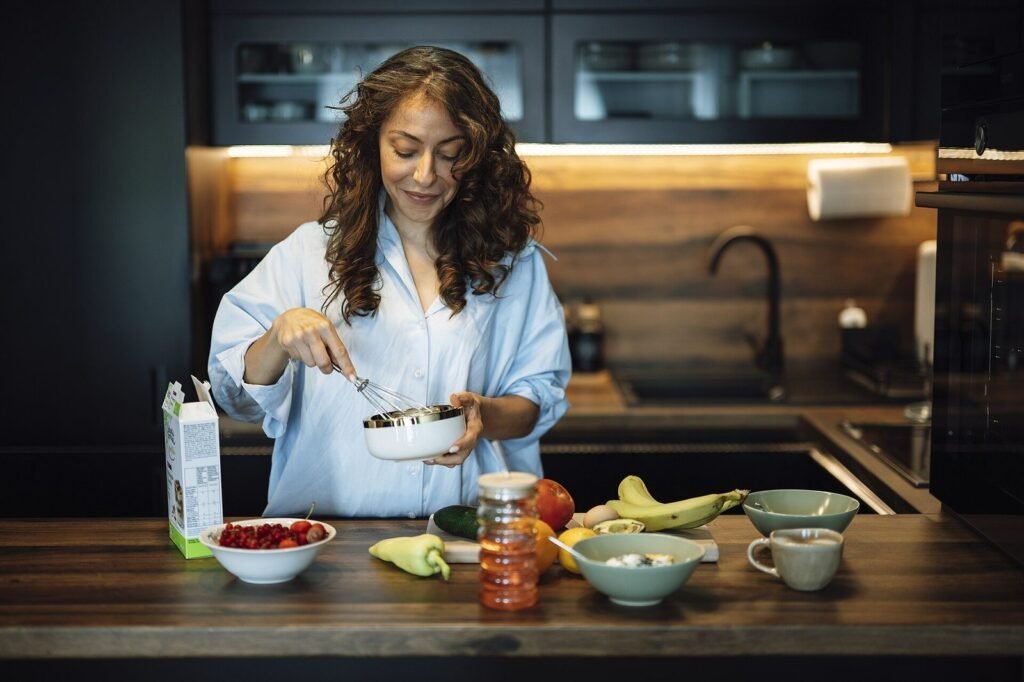 Woman preparing a healthy breakfast at a tidy kitchen counter